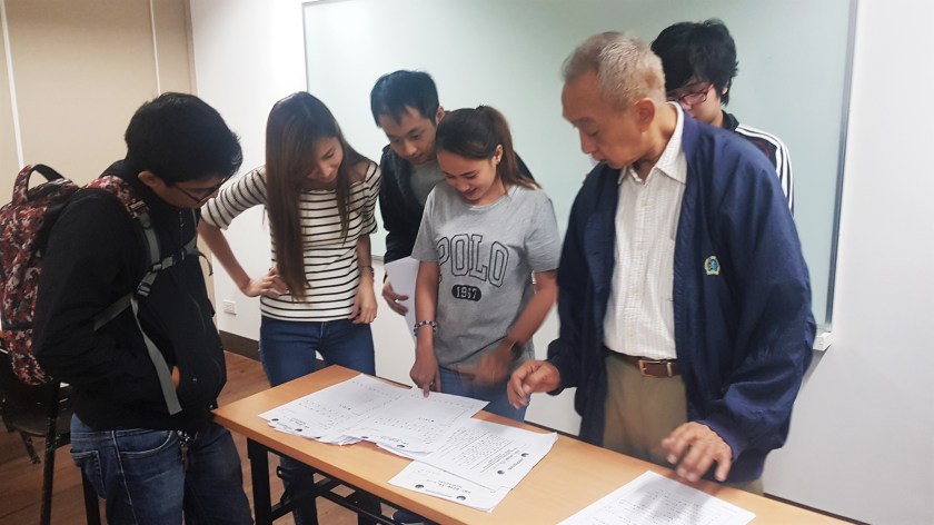 Students checking their test results at a classroom in Nihongo Center Foundation Makati Branch