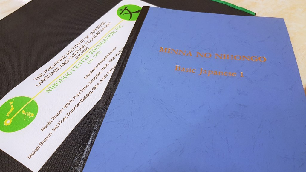 Basic Japanese 1 textbook with blue cover used at Nihongo Center Foundation